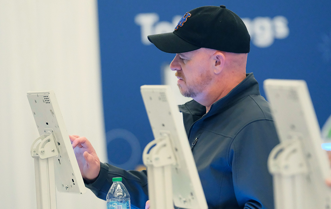 Image of person using a kiosk