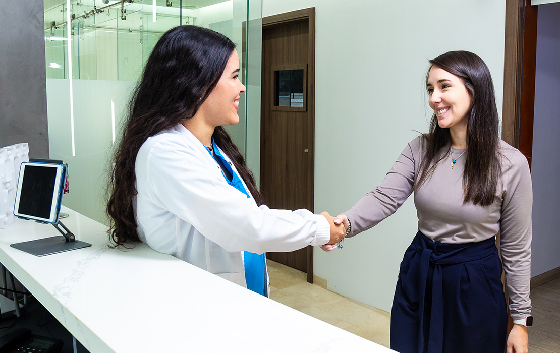 Dentist greeting patient