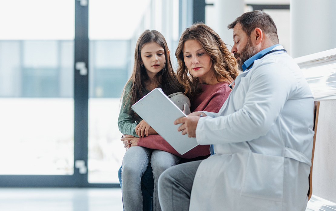 Family talking to dentist