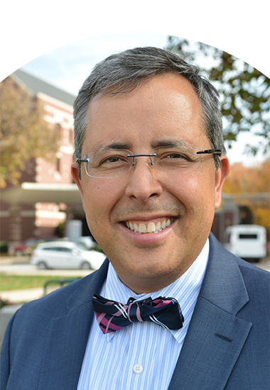 A photographic portrait of ADA Smilecon 2022 scheduled speaker, Juan F. Yepes, DDS, MD, MPH, MS, DrPH