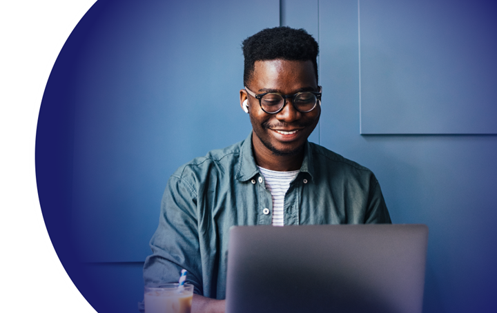 smiling man at laptop