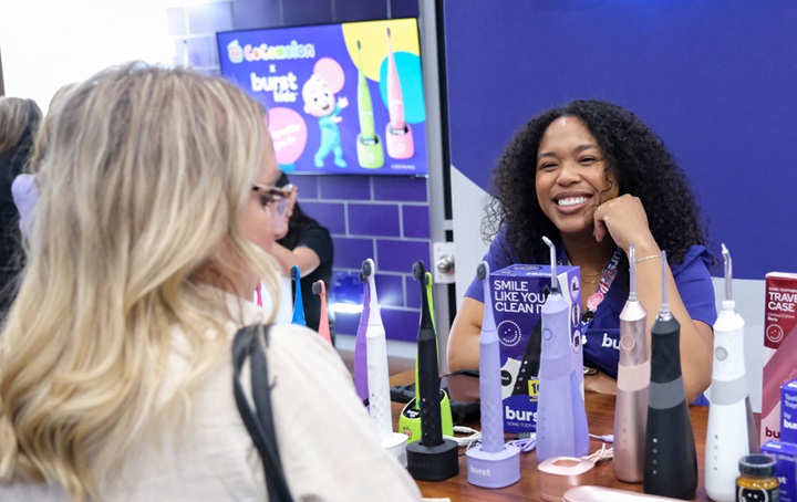 SmileCon attendee engages with an exhibitor