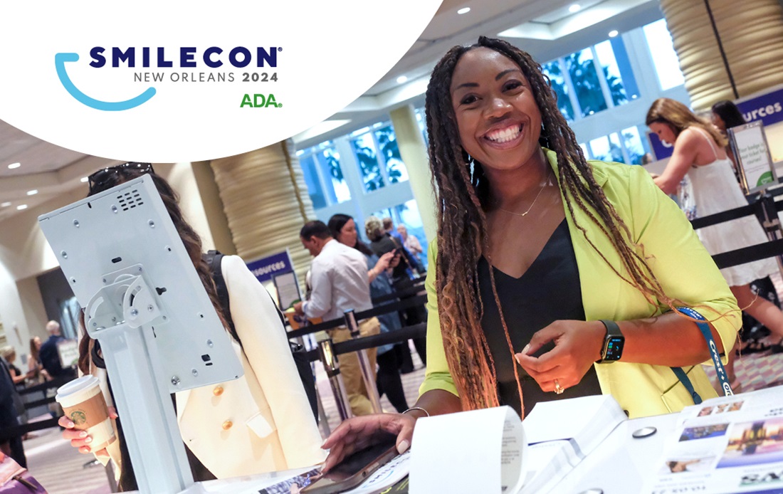 Happy SmileCon attendee checking into Registration