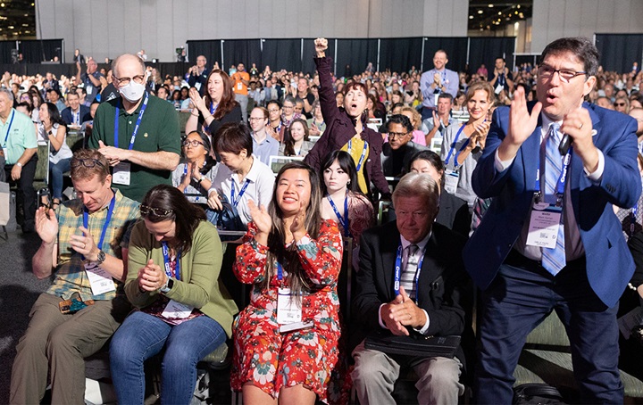 Cheering crowd at SmileCon Opening Session