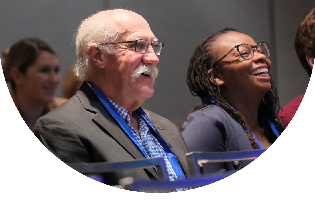 SmileCon attendees watching presentations on the main stage