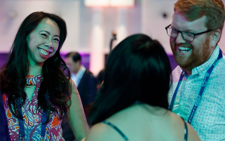 3 attendees socializing