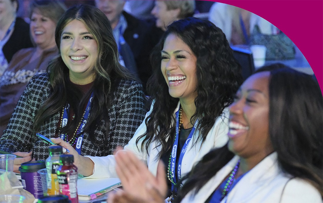 Group of woman attendees smiling and laughing