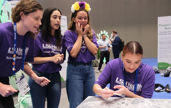 Group of attendees playing a dice game