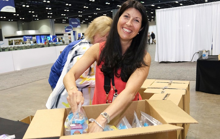 Volunteer unpacking a box