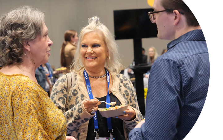 Attendees socializing during snacks