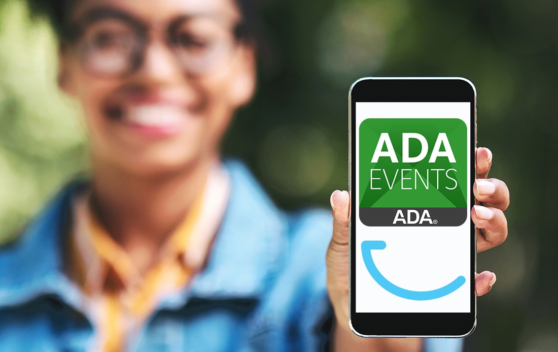 Woman holding smart phone with SmileCon ADA Events App