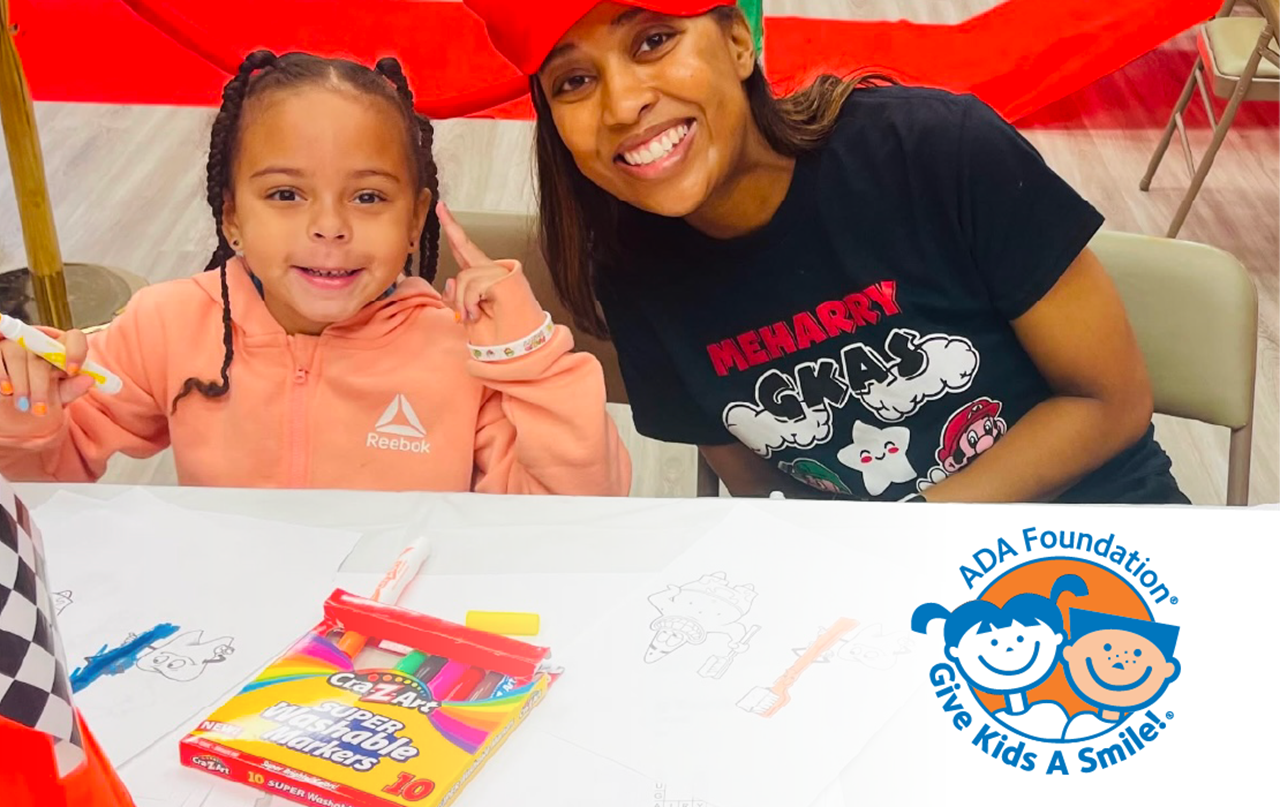 Give Kids a Smile showing parent and a child coloring