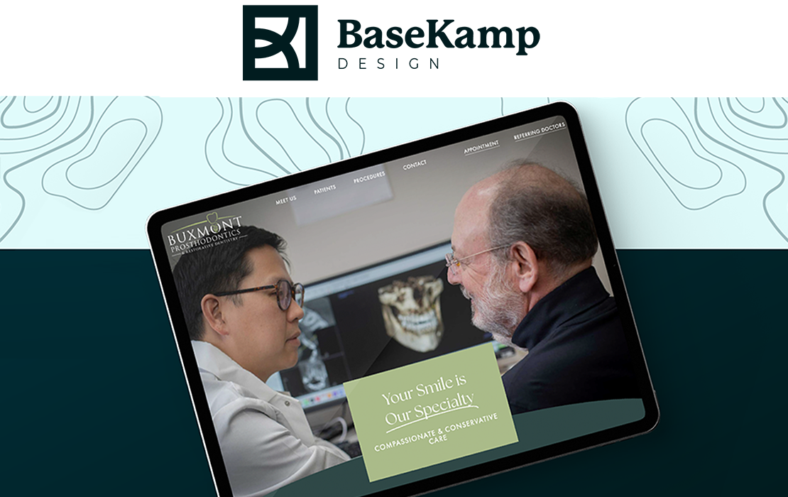 BaseKamp — Buxmont Prosthodontics, two men talking computer in background