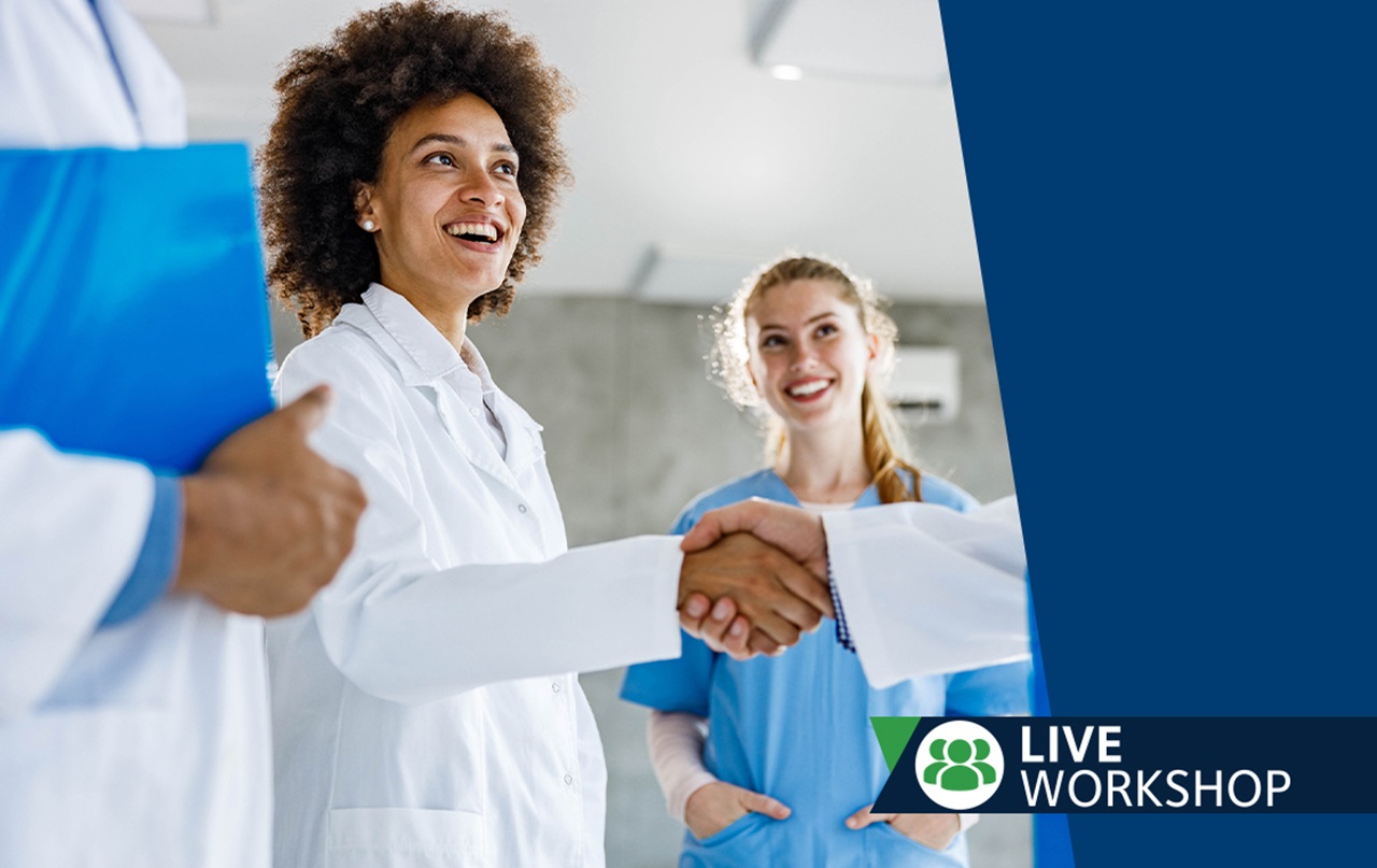 An image of a couple woman smiling during a live workshop.