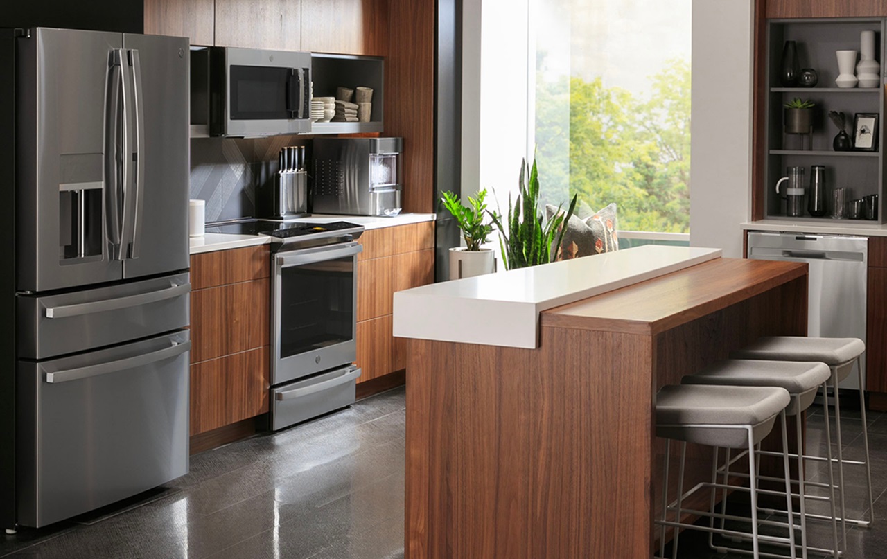A kitchen with a GE refrigerator