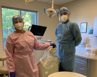 Photo of dentists wearing PPE