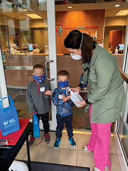 Image of Dr. Jessica Meekse and two young patients