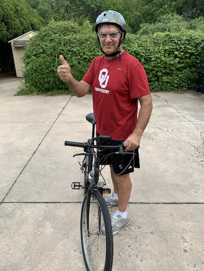 Photo of Dr. Cohlmia with bicycle