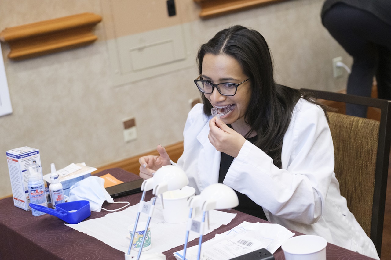 A dentist uses a tray during a hands-on event at SmileCon in Las Vegas