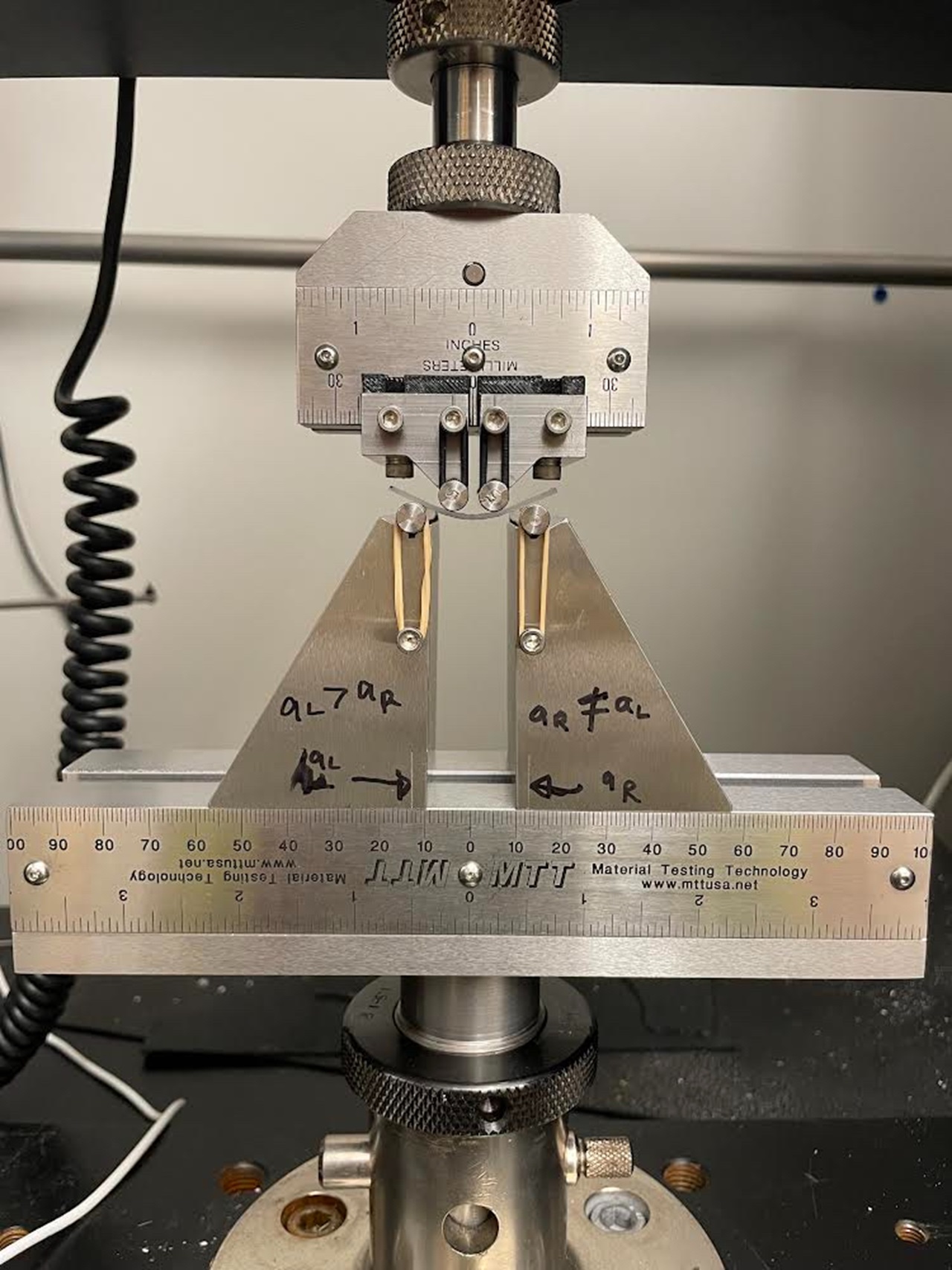 Photo of apparatus to test strength of aligner materials
