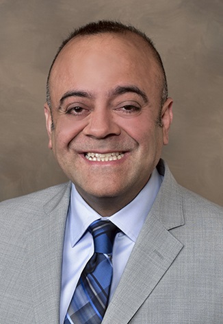 A photographic portrait of Dr. Mehrabi Mehran.