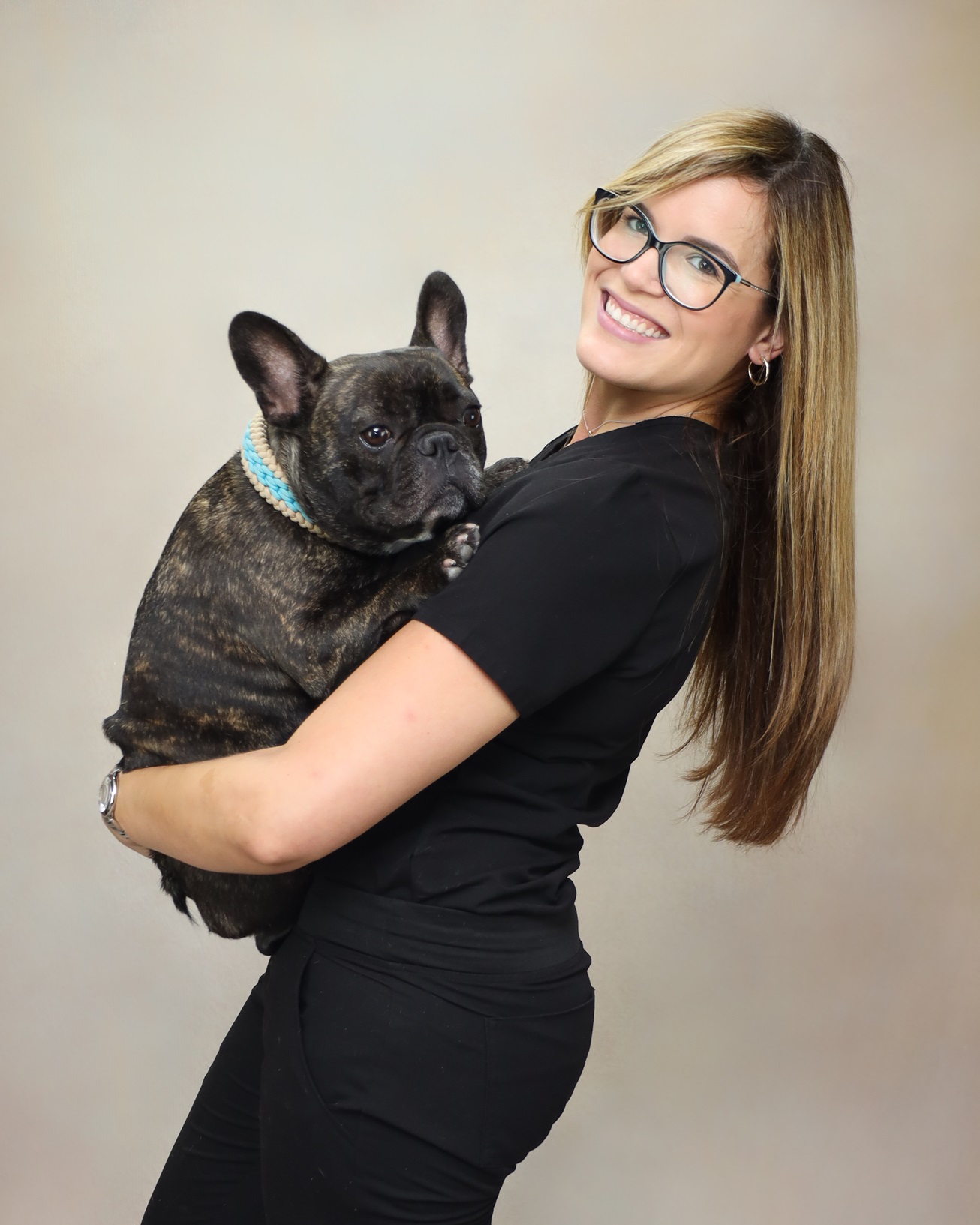 Dr. Arroyo-Julia poses with her dog