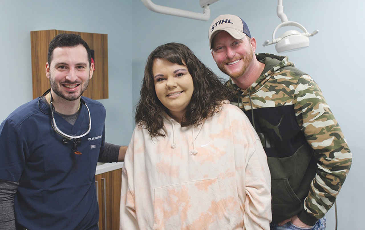 Image of Dr. Mike Petrides with patients at Wheeling Health Right dental clinic