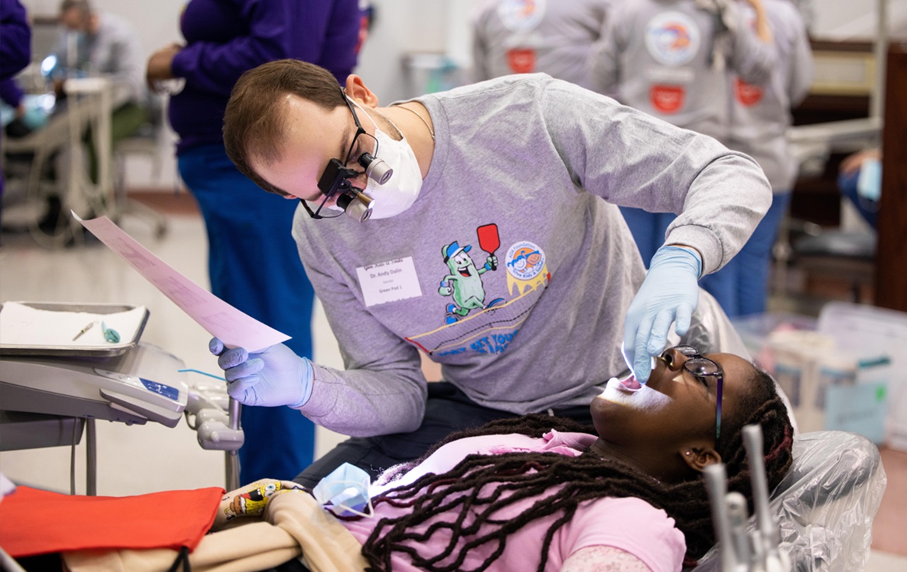 Treatment: Andy Dalin, D.D.S., examines Abigail Feb. 3 during the national Give Kids A Smile kickoff event in St. Louis.