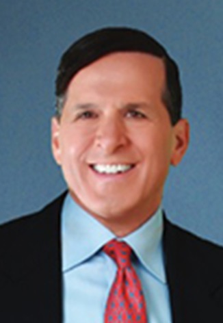 A photograph of Dr. Roger P. Levin.