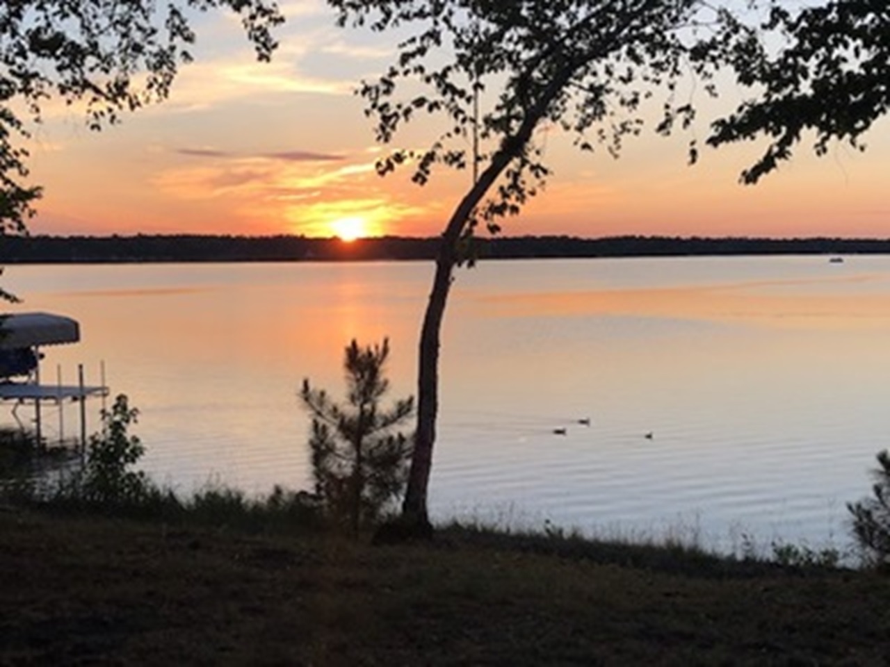 An image of a lake behind a vacation home located in Rochester, Minnesota