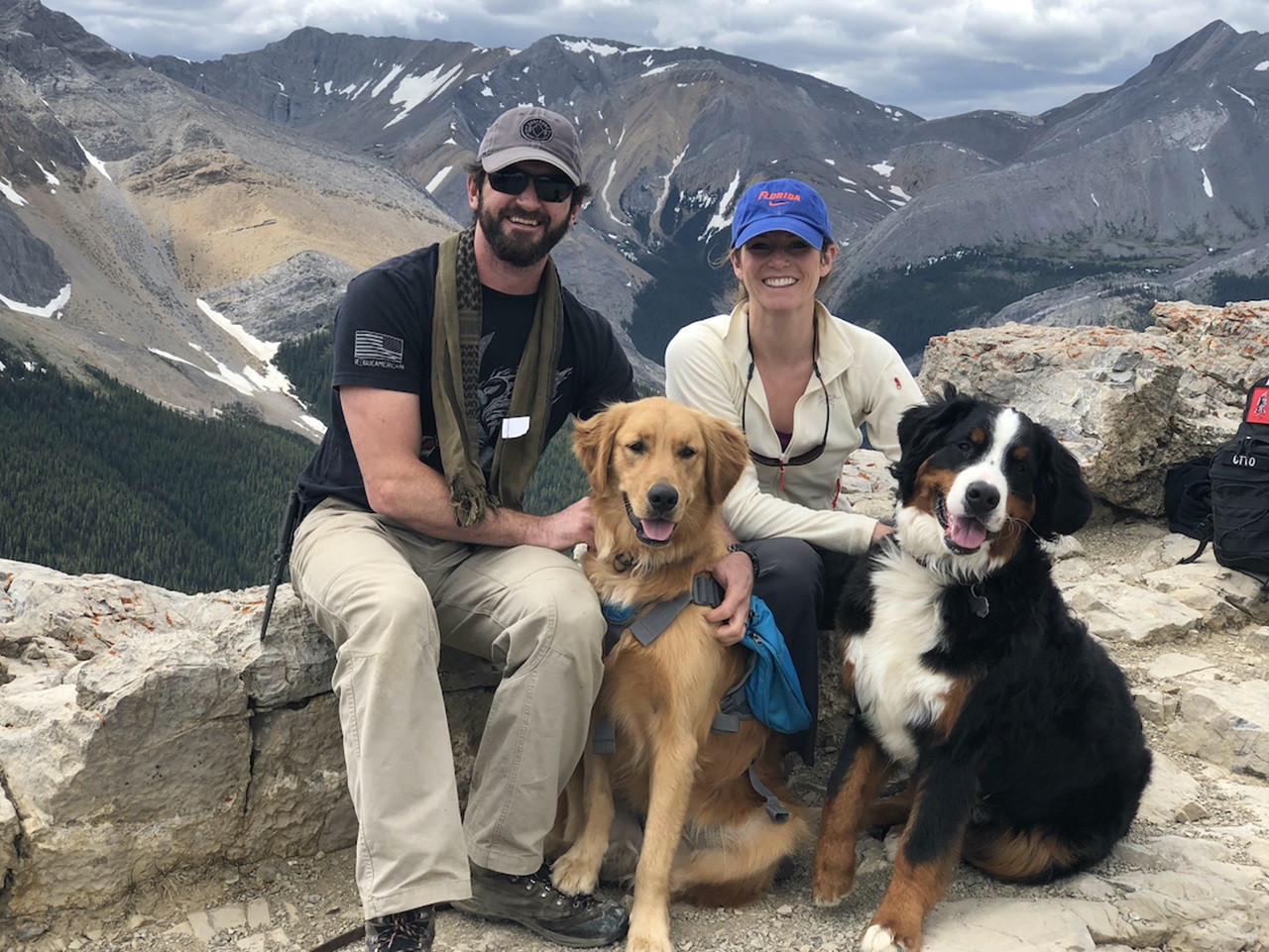 Photo of Dr. Otto, husband and dogs