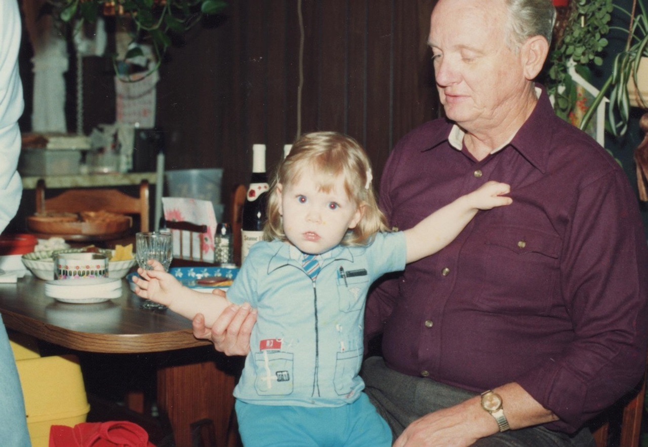 Photo of Dr. Mattingly dressed as dentist while toddler