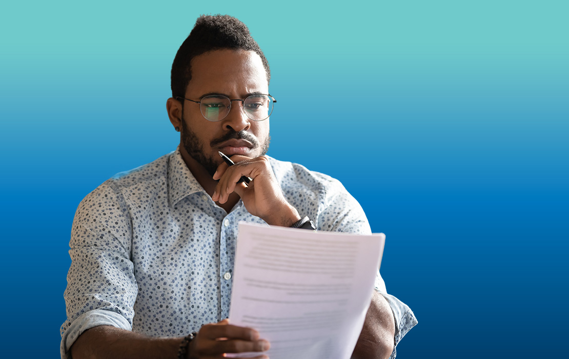 Contract Resources, A photograph of a man reviewing a contract.