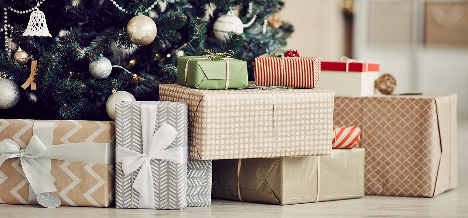 Wrapped Christmas presents under a tree