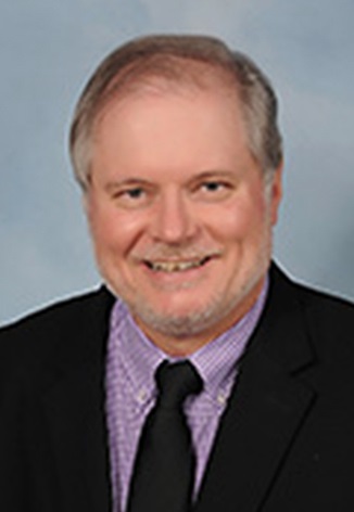 Professional headshot of Dr. Bill Claytor
