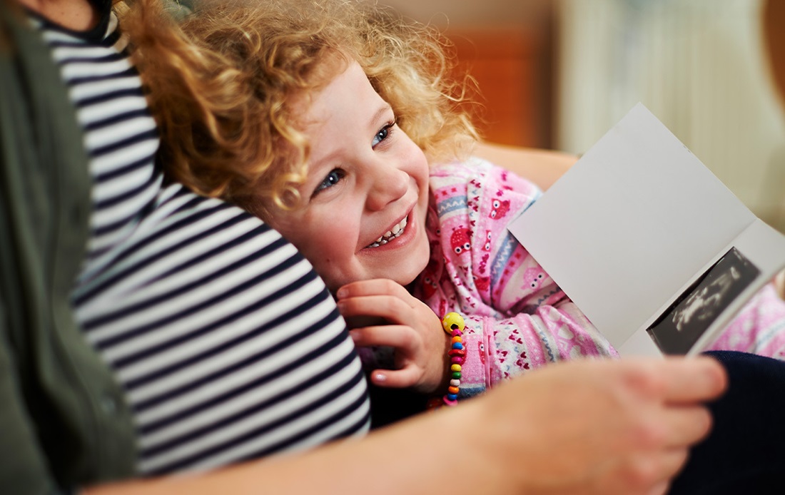 A young child smiling