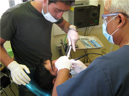 Clinicians treating patient in Afghanistan