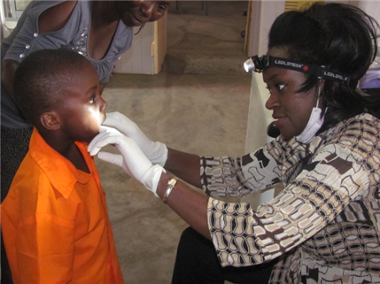Dentists examining child