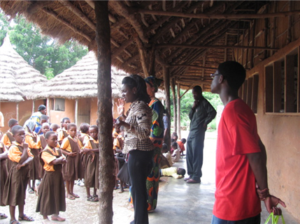 Dentist giving oral health education in Africa