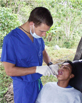 dentists treating young man