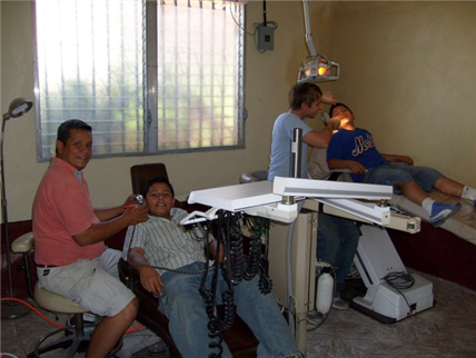 Dental clinic with two chairs and children in chairs