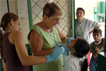 dentist examinig girl