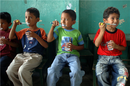 4 boys brushing