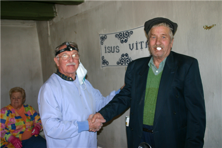 dentist shaking hand of patient