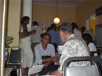 US volunteer and haitian dentist speaking to each other