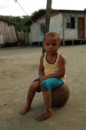 Young boy sitting on a ball