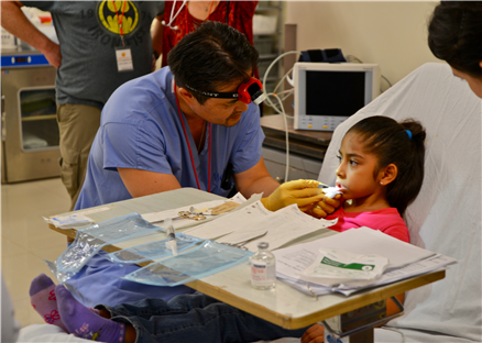 Dentist treating girl