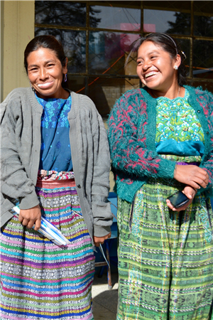 Two women outside clinic smiling