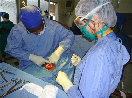 two surgeons operating on patient