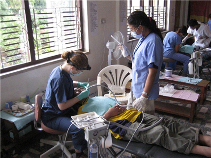 dentist treating patient in chair